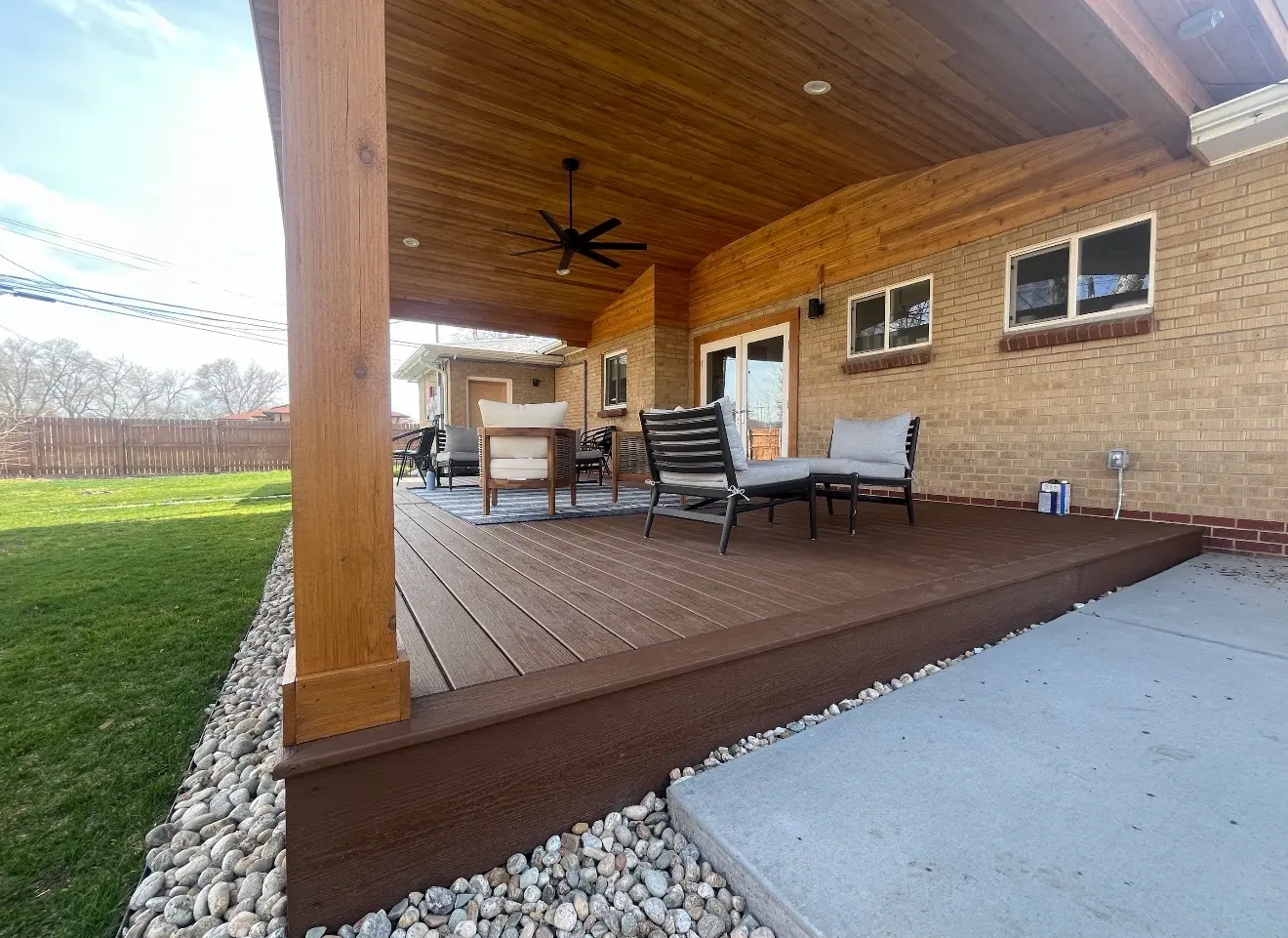 Composite deck and covered patio with seating in Wheat Ridge Colorado